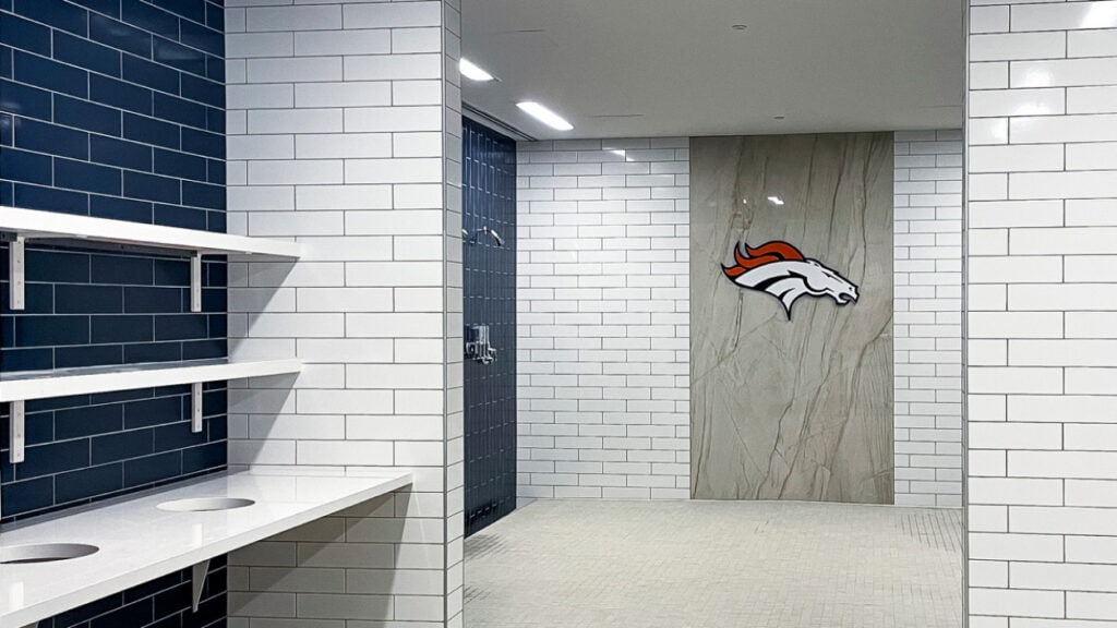 Locker Room Showers Broncos Logo White Blue Tiles